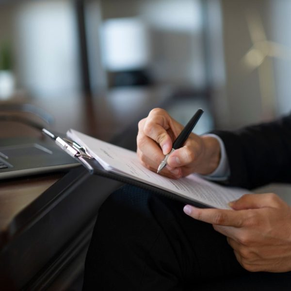 Unknown businessman prepares official document Unknown businessman prepares official document